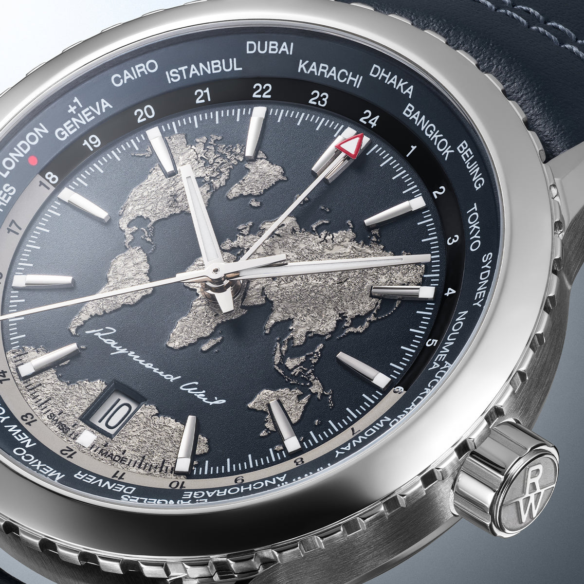 Macro of the World-Traveller champagne textured continents, GMT pointer and city ring